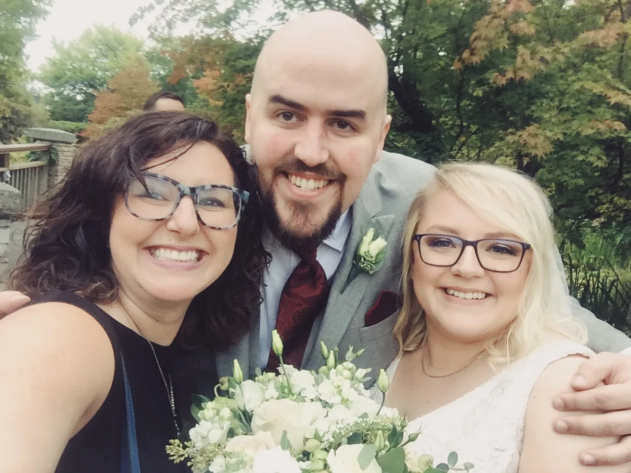 Officiant Lani snaps a selfie with the newlyweds Colleen and Dominic