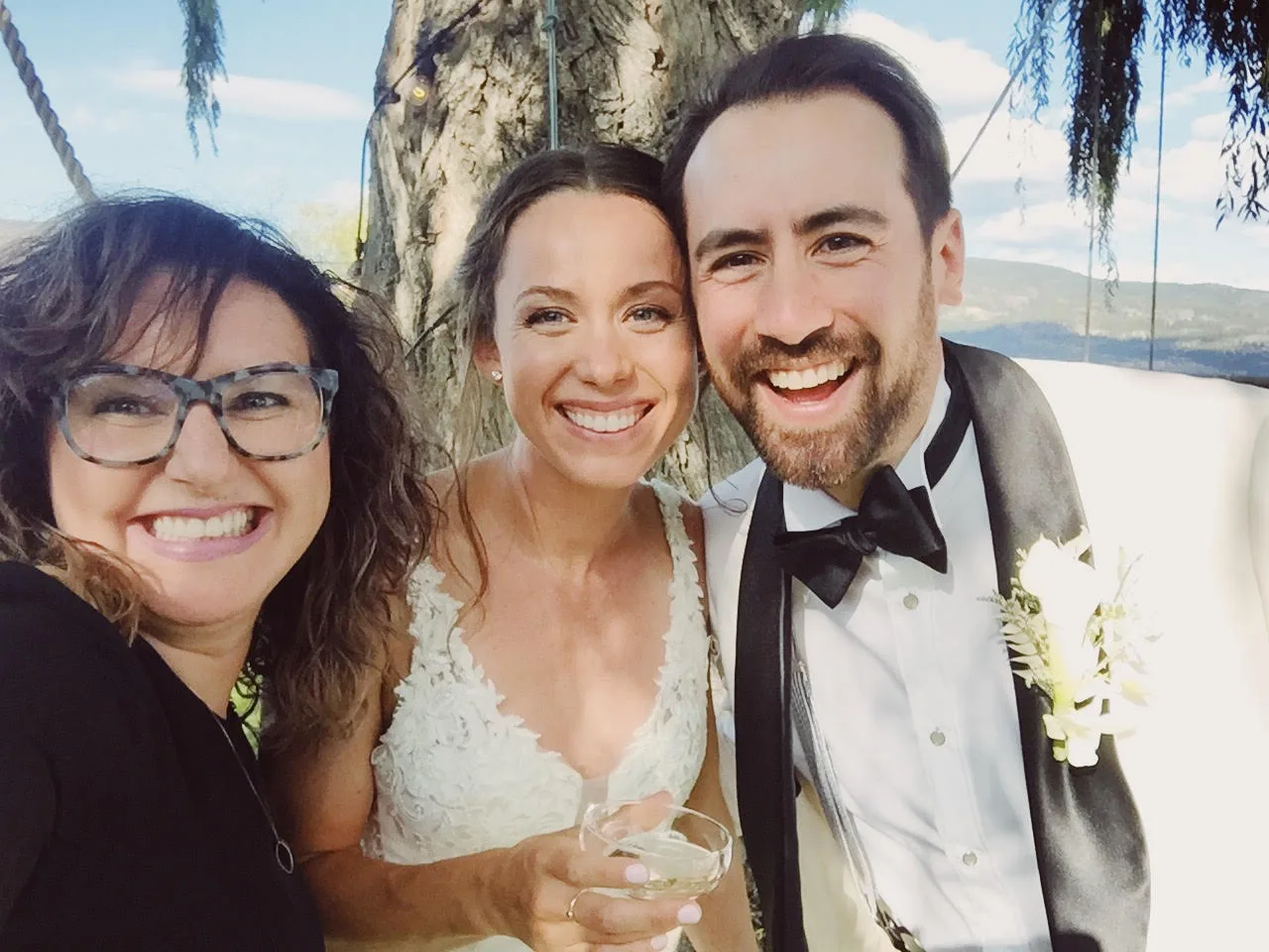 Selfie of Krista & Andrew with Officiant Lani