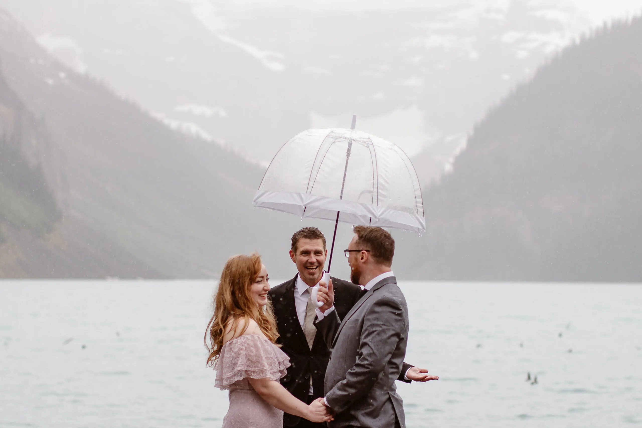Officiant Rich marrying a couple in the rain in Alberta