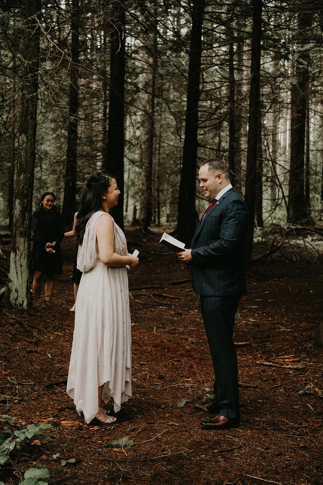 couple exchanging vows in the forest in Vancouver