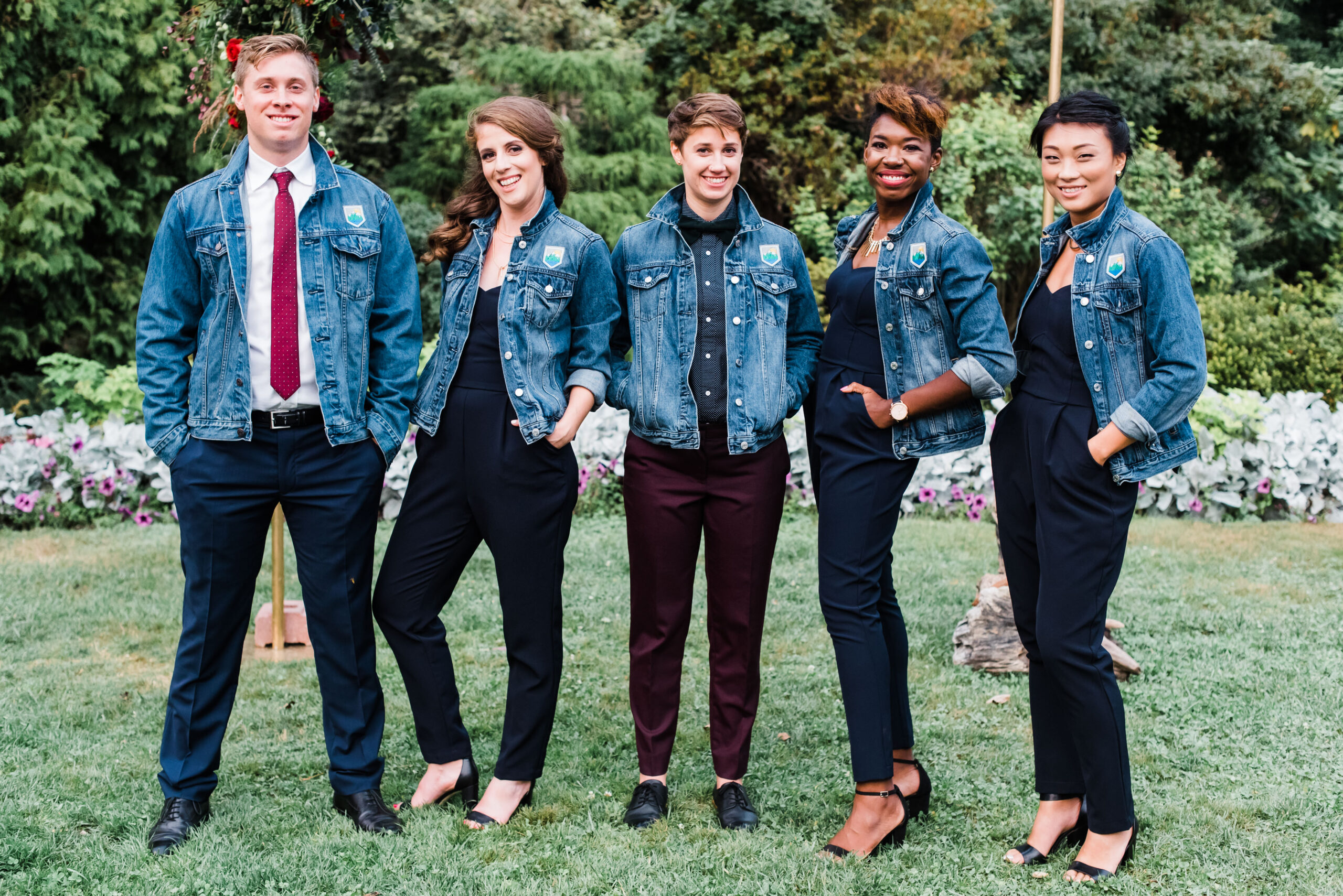 wedding party dressed in denim jackets and jumpsuits