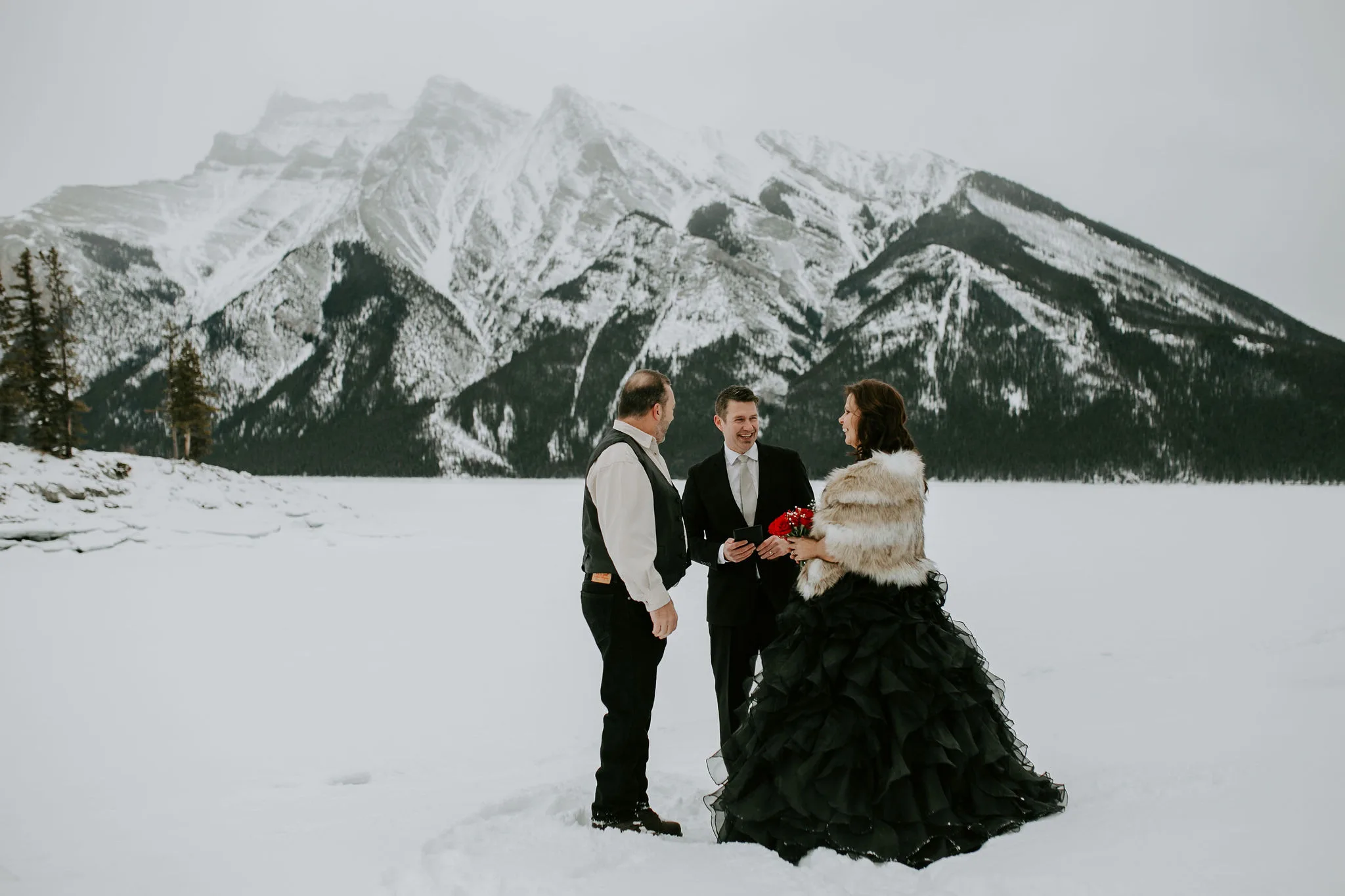 Officiant Rich marrying a couple during an elopement in the snow