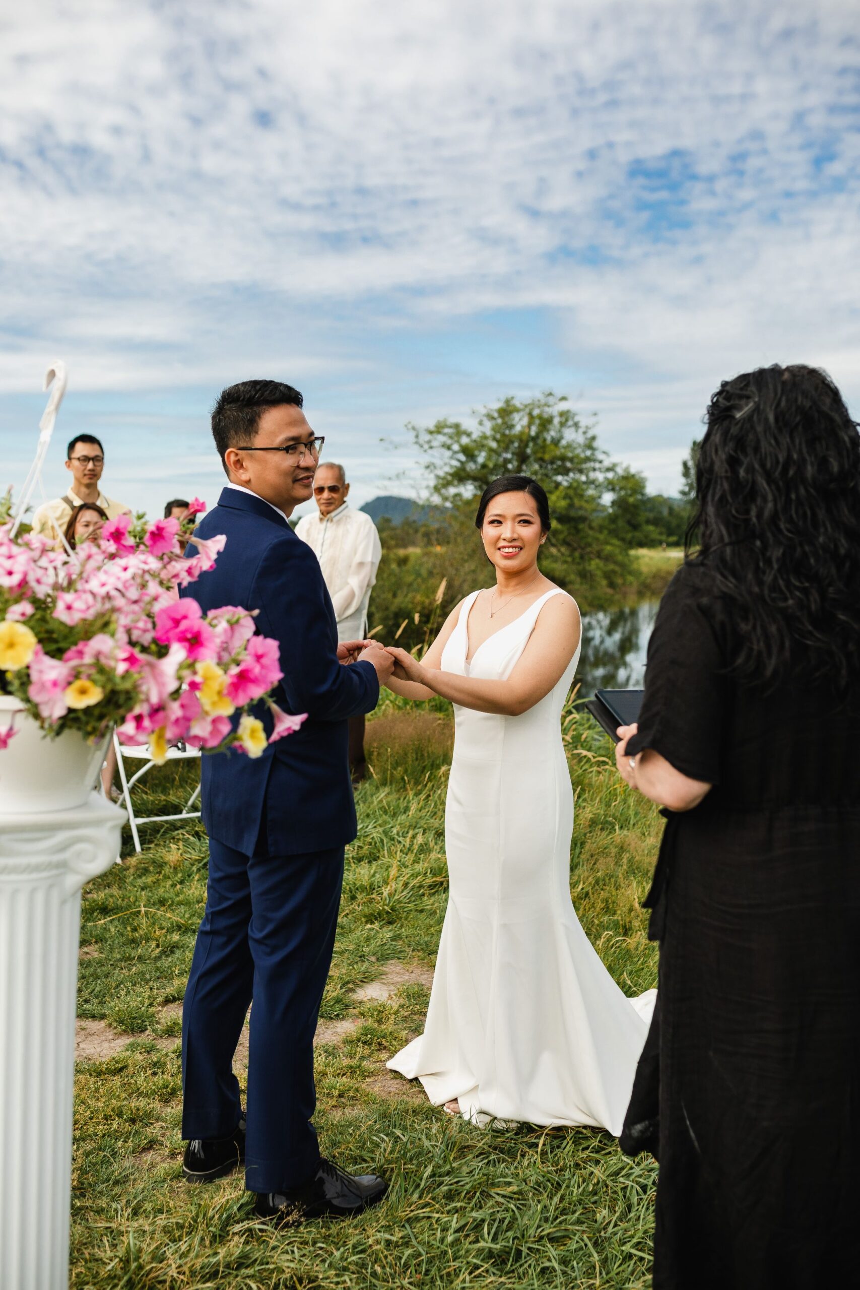 outdoor garden wedding with young hip and married wedding officiants