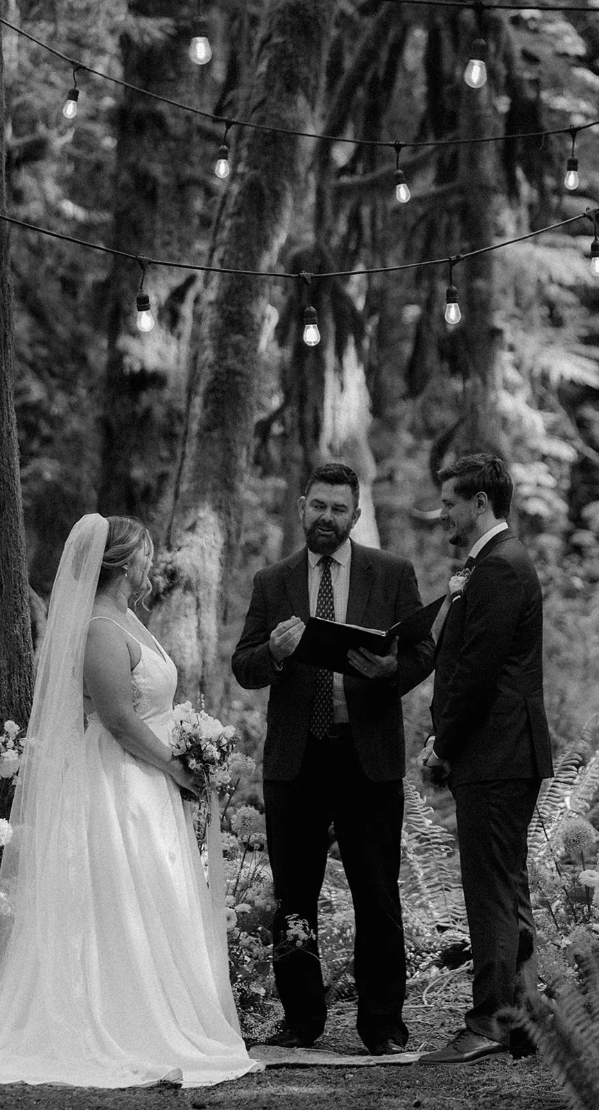 Elyssa + Tim with Officiant Curt during their wedding ceremony