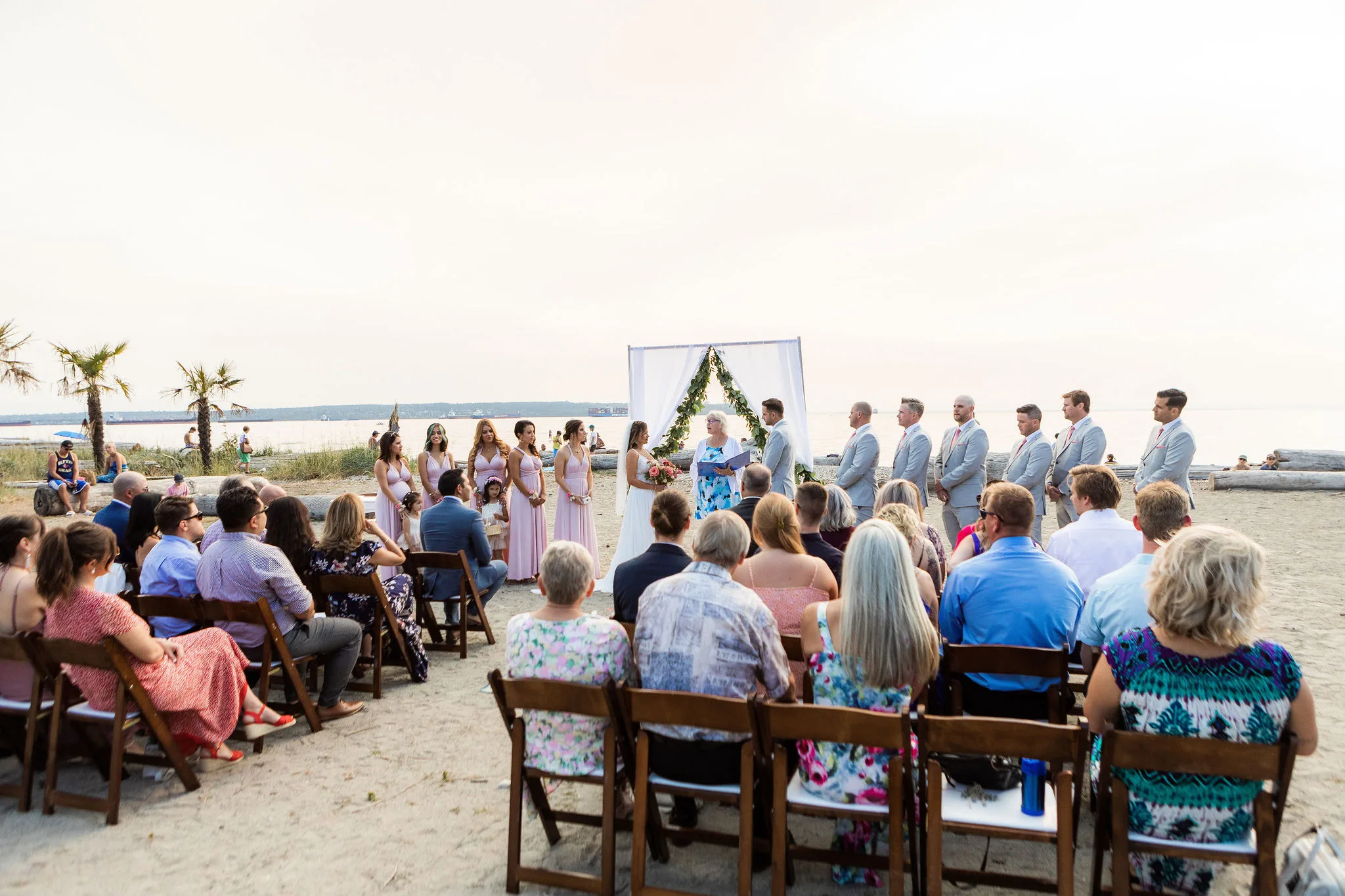 non denominational wedding officiant with young hip and married, beach wedding