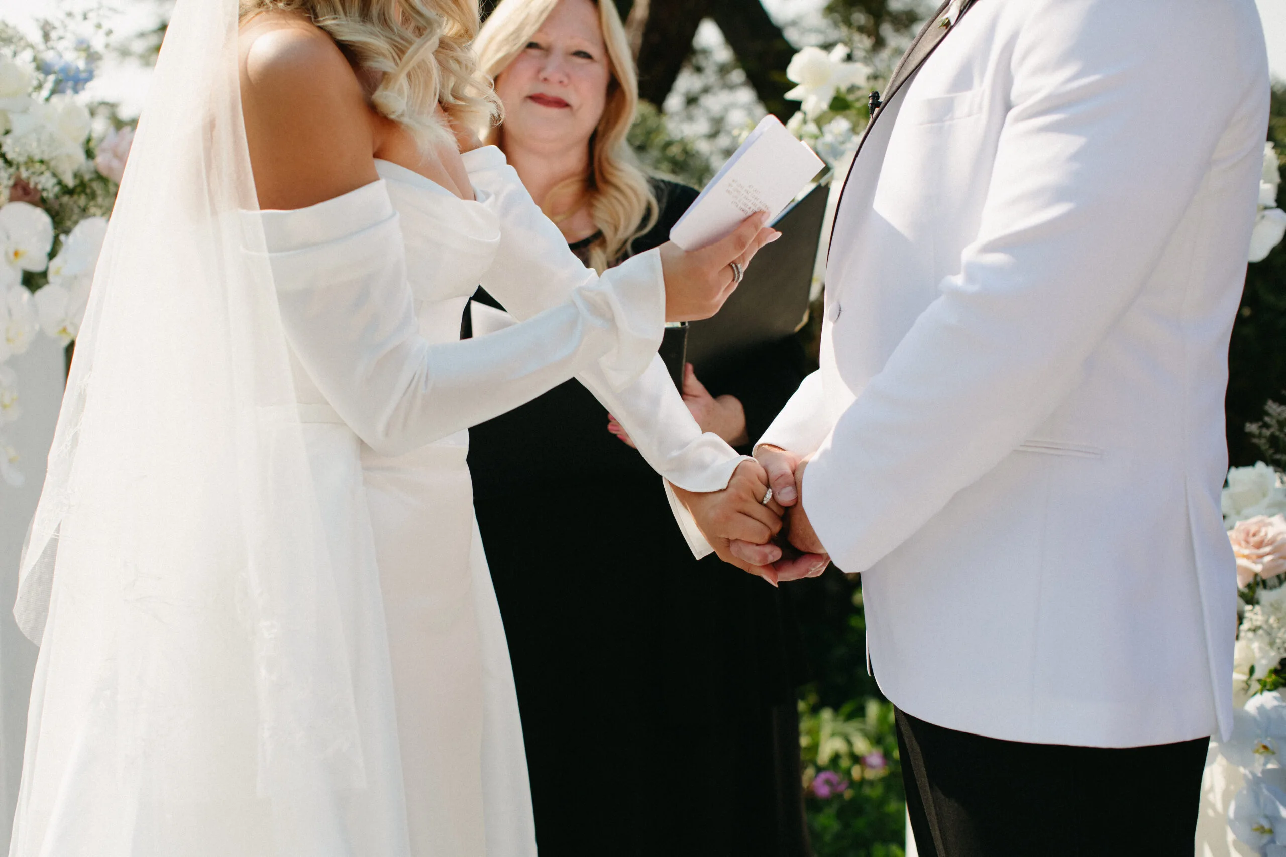 Brittany & Graeme reading their vows during a ceremony with Officiant Melinda