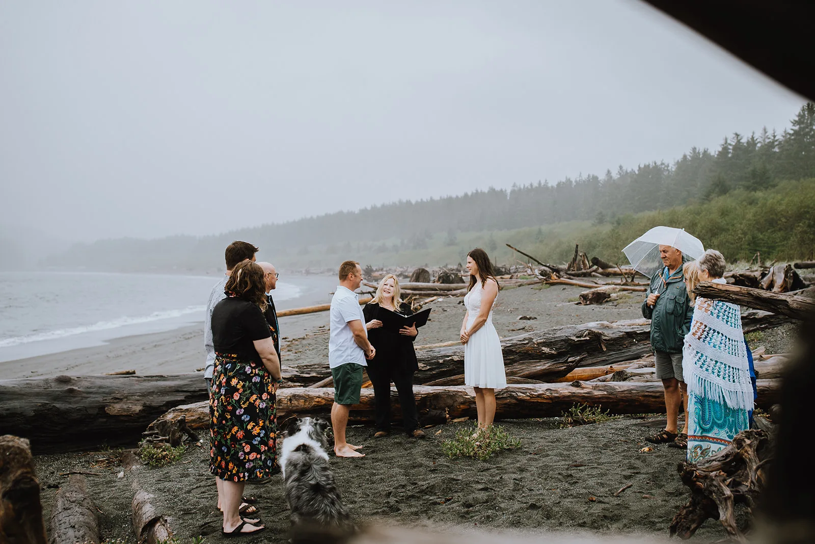 Officiant Melinda leading an elopement ceremony on the beach on Vancouver Island