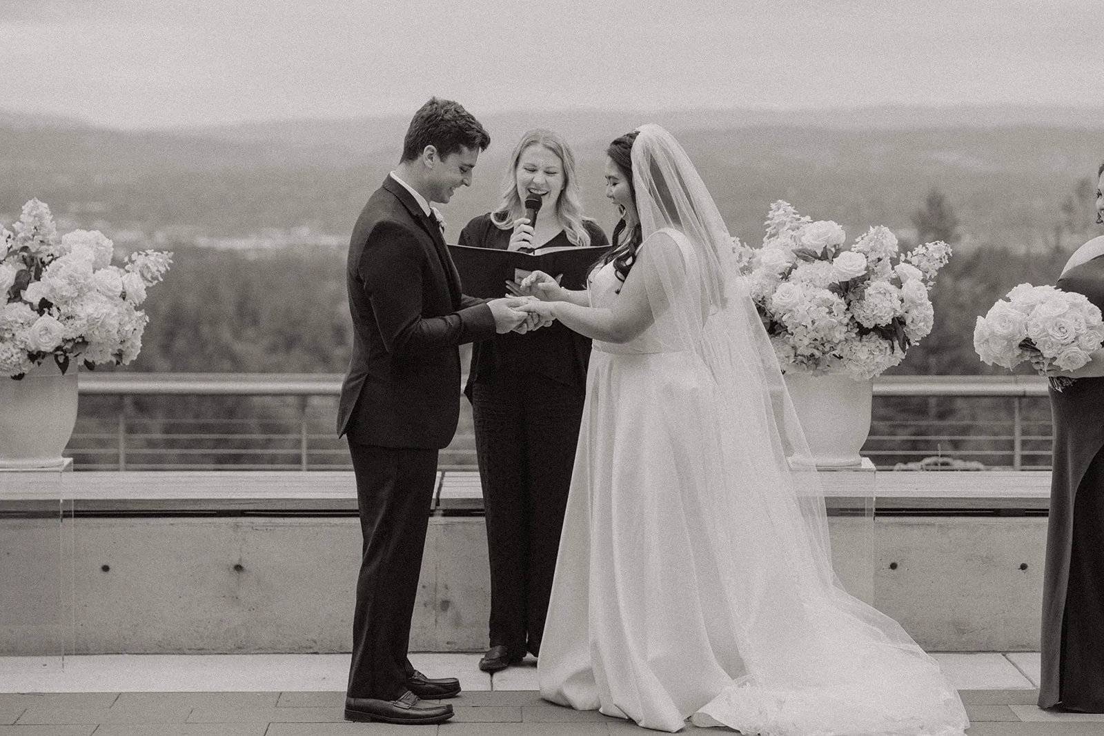 Couple exchanging rings during their ceremony with Officiant Sarah in Oregon