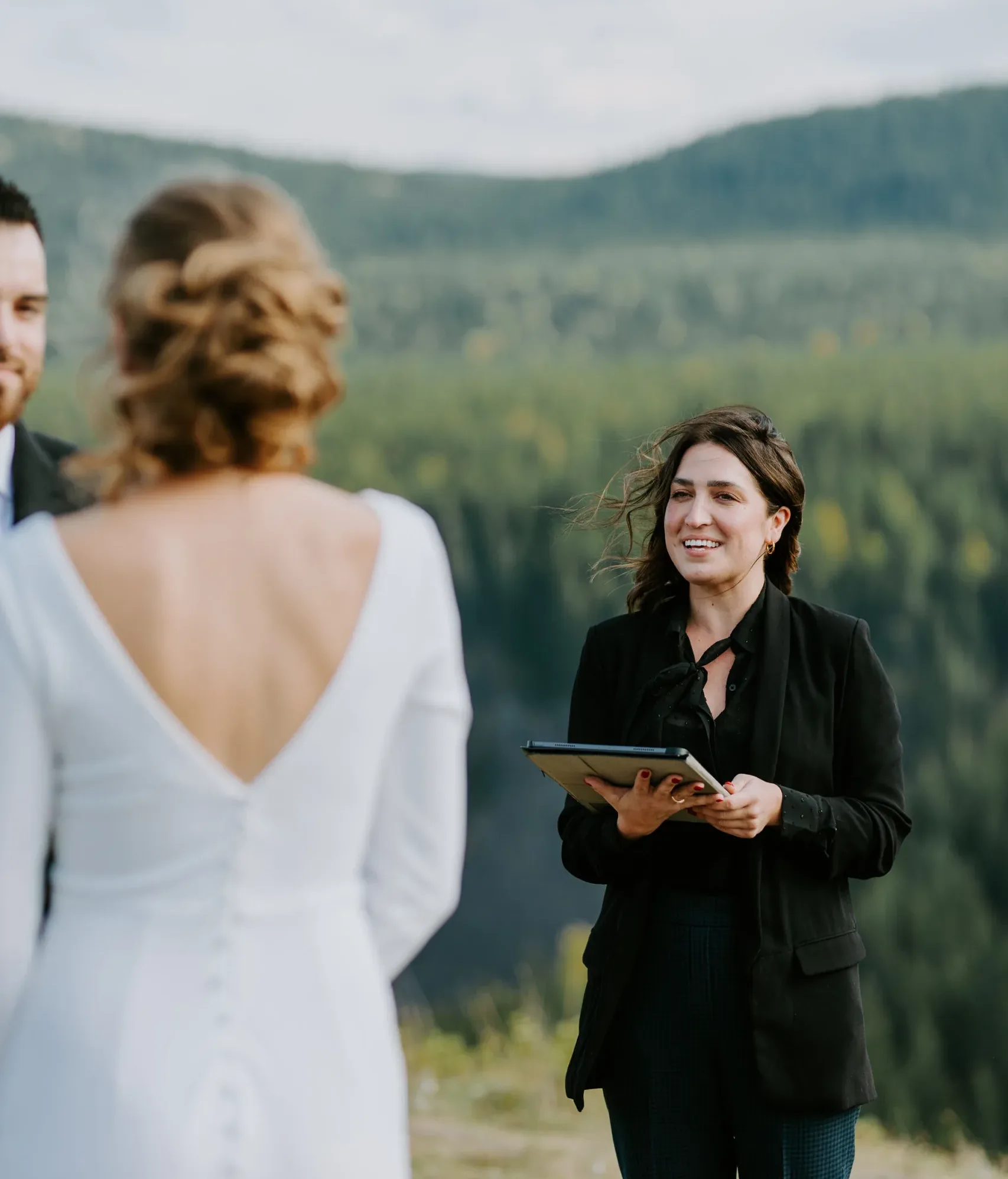 Officiant Andria leading an elopement ceremony outside of Calgary