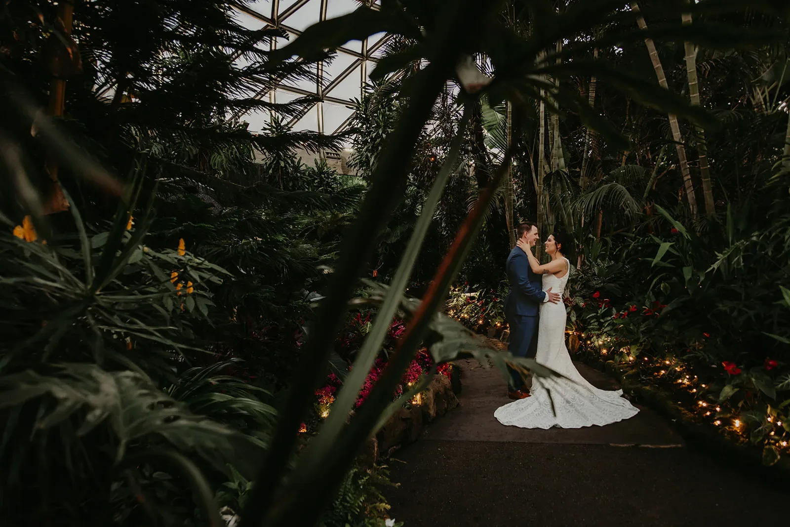 Newlyweds embracing each other in Bloedel Conservatory