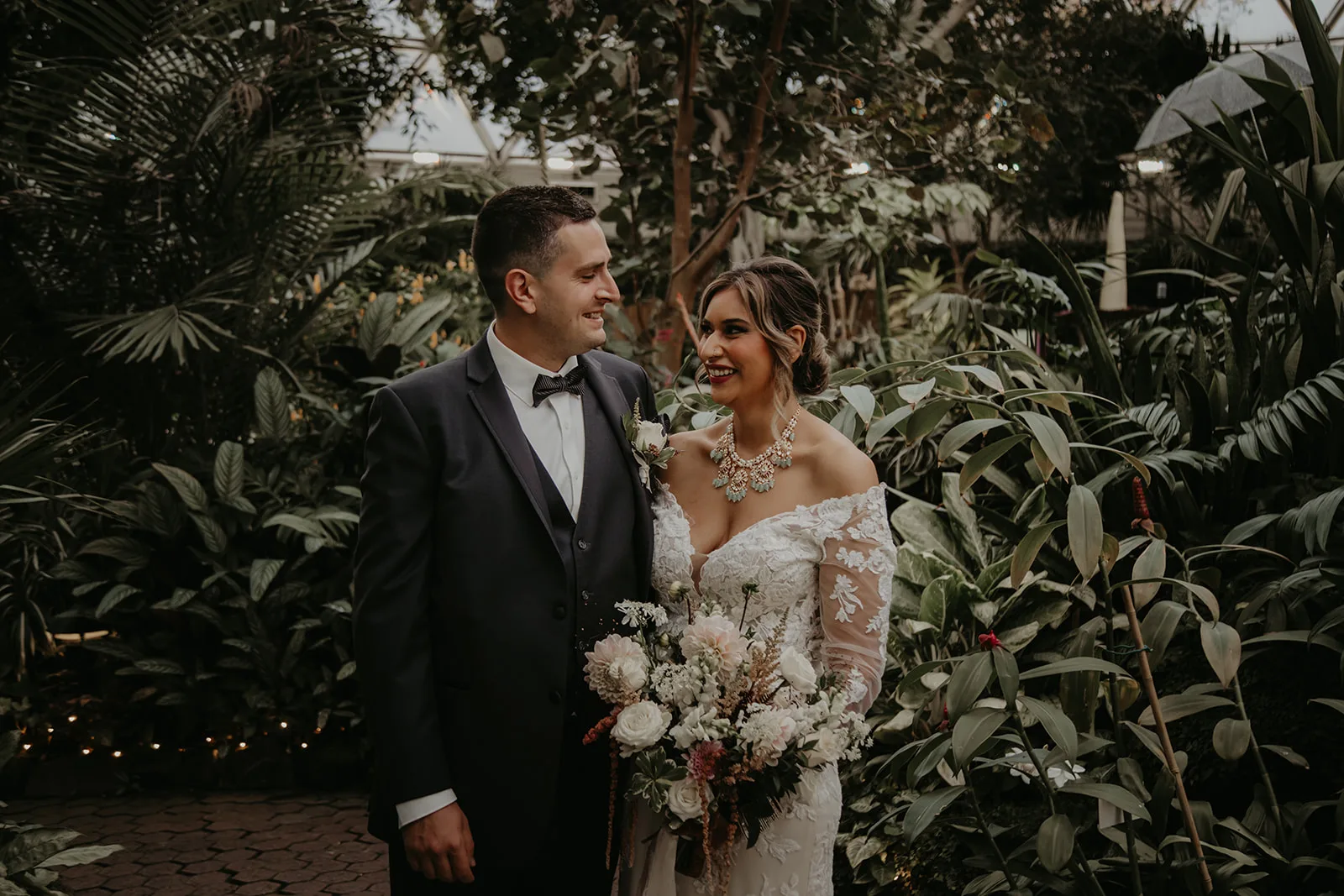 Newlywed couple smiling at each other after their Bloedel Conservatory wedding
