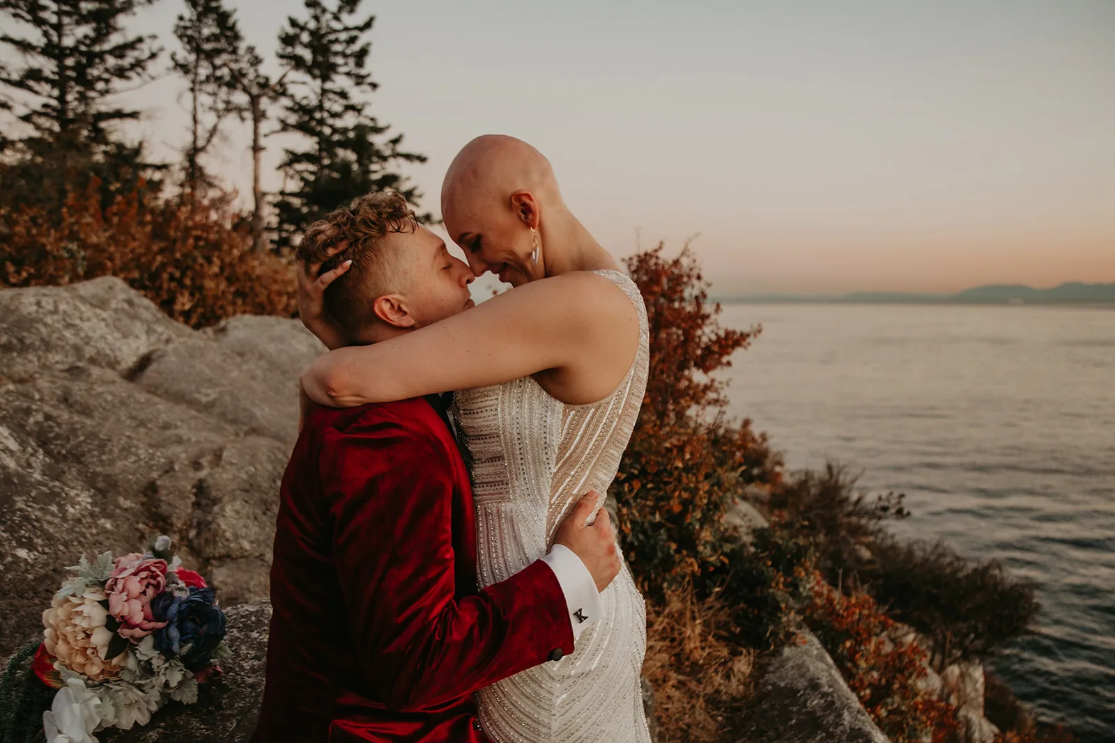 Newlyweds Shelby and Curt embracing after their elopement at Whytecliff Park with Officiant Erika and Erica Miller Photography