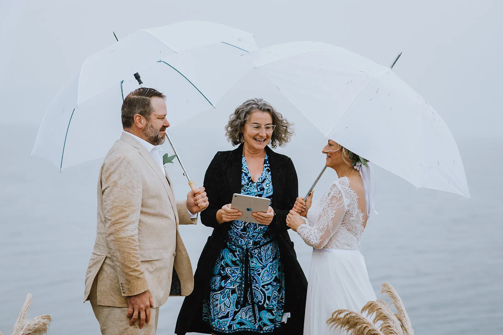 Officiant Amanda leading an elopement on a rainy day