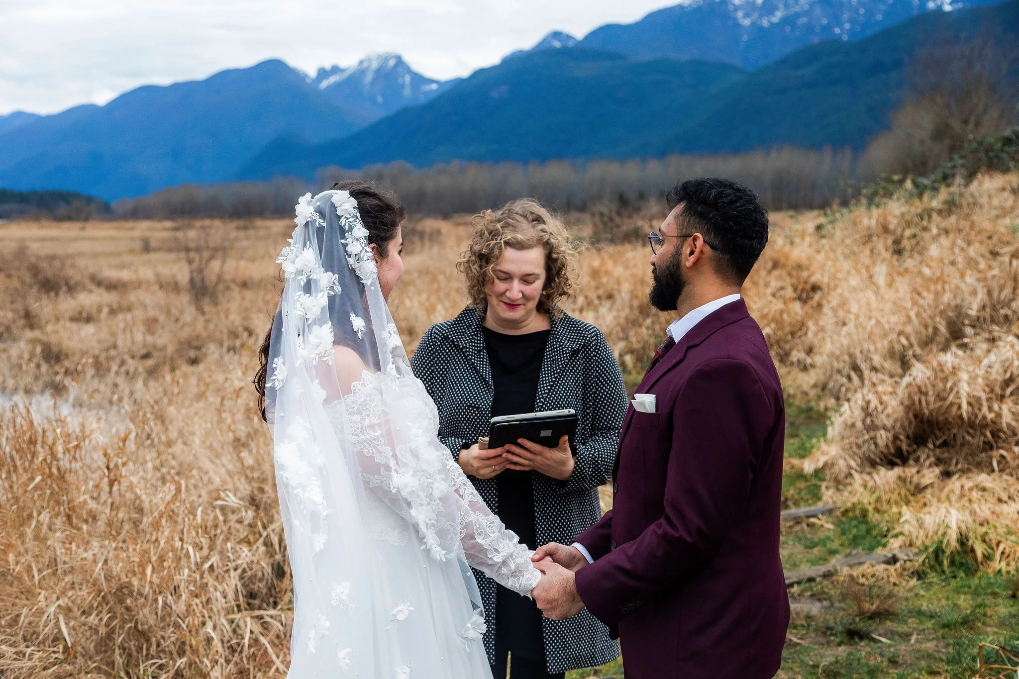 Officiant Shalom marrying Beth and Muneer at Pitt Lake