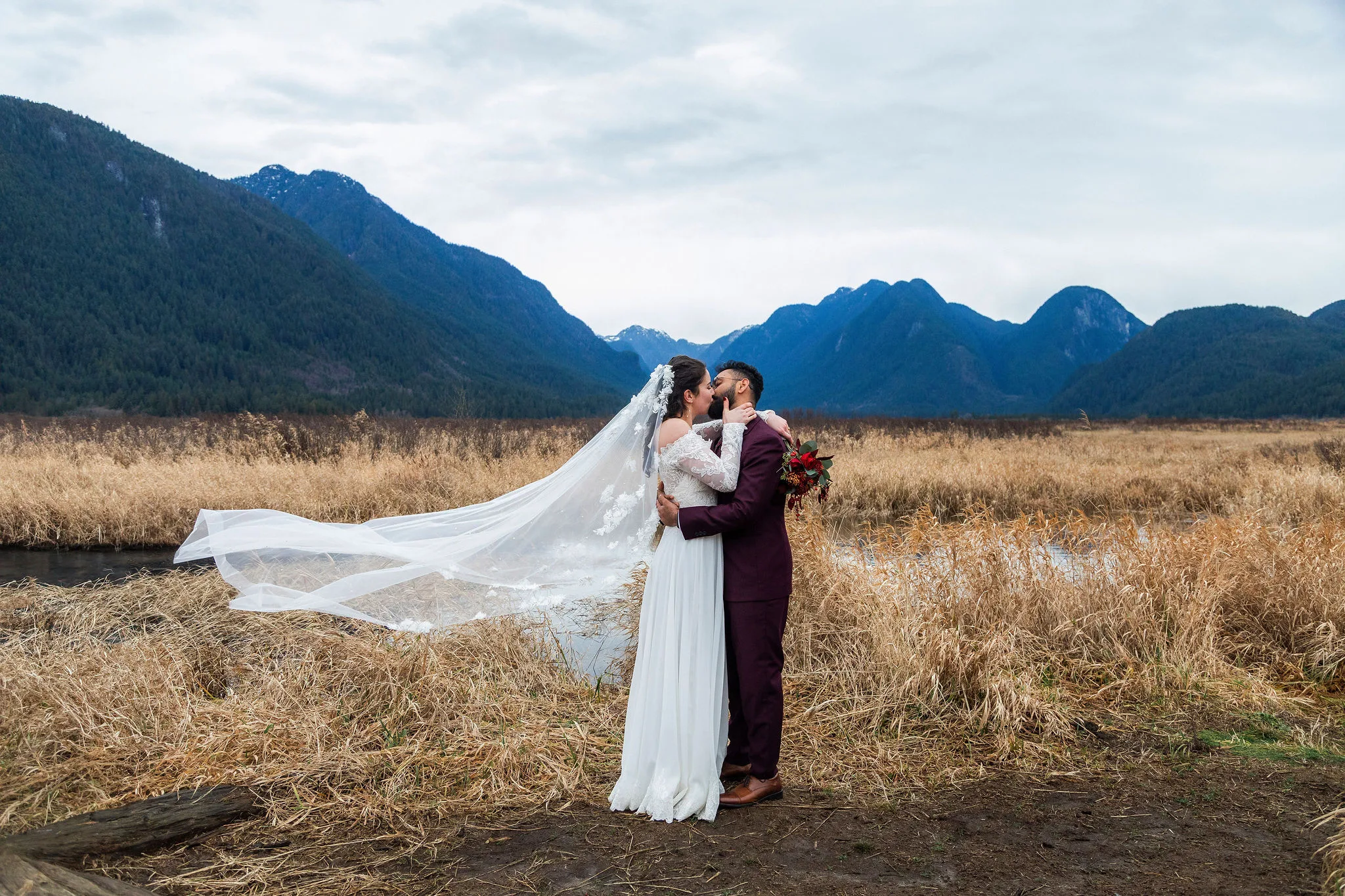 Bride and groom kissing after their elopement at Pitt Meadows