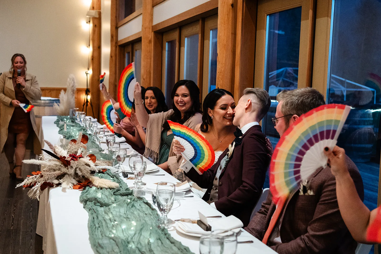 Megan and Claire celebrating with rainbow fans at their reception, Kaitlin Day Photos