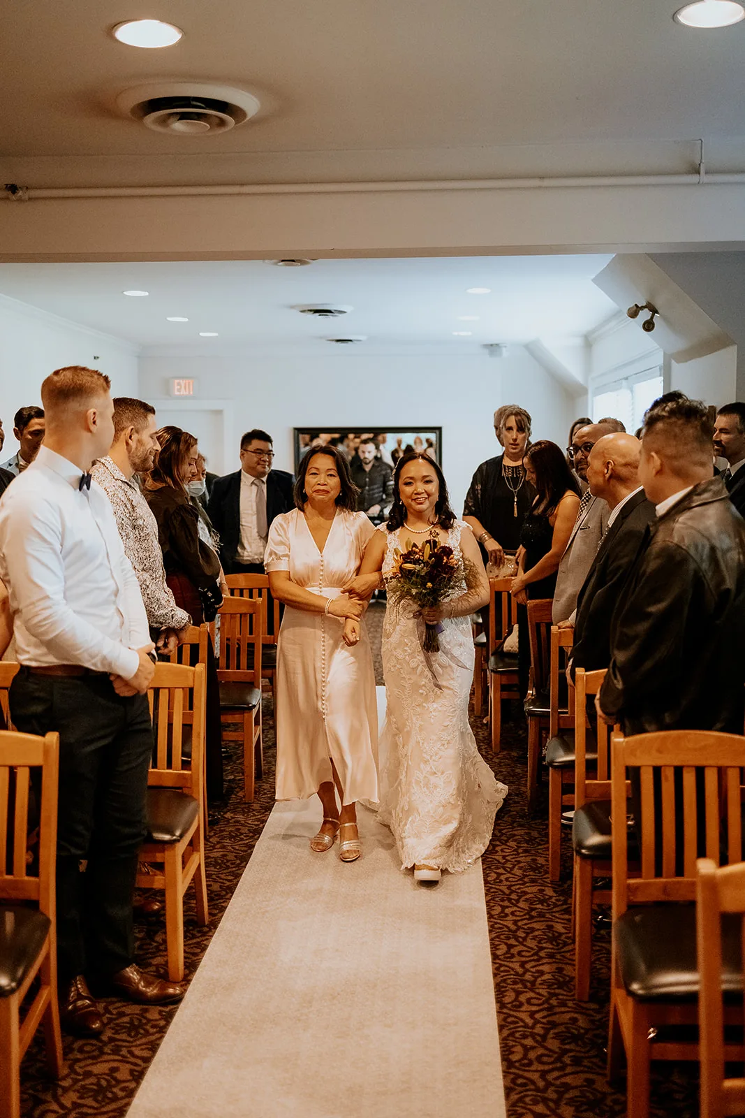 Nikki walking down the aisle to Thomas with her mother, Ryan Funk Photography