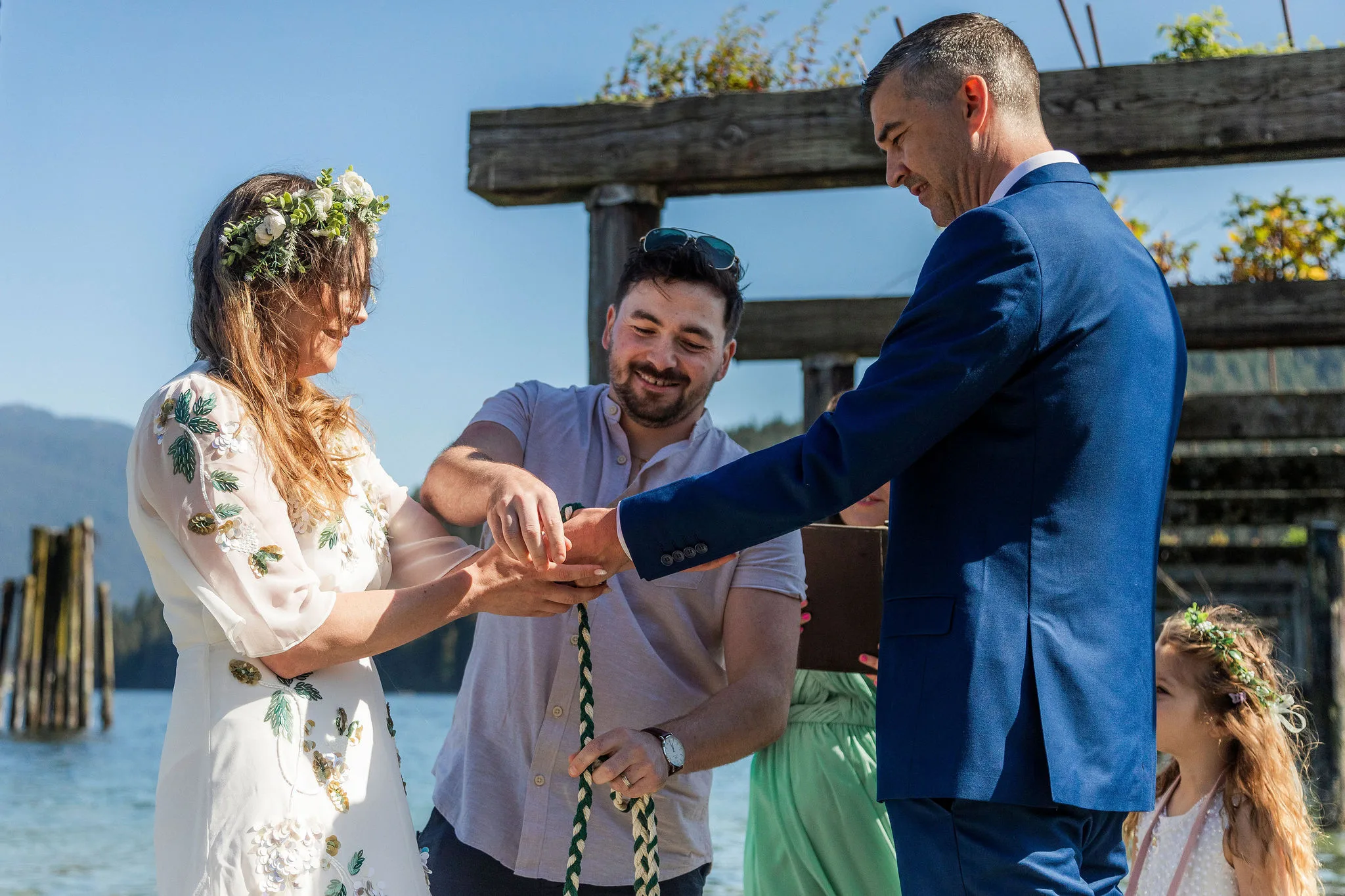 Seana and Gary doing a handfasting ritual during their wedding ceremony, John Bello Photography