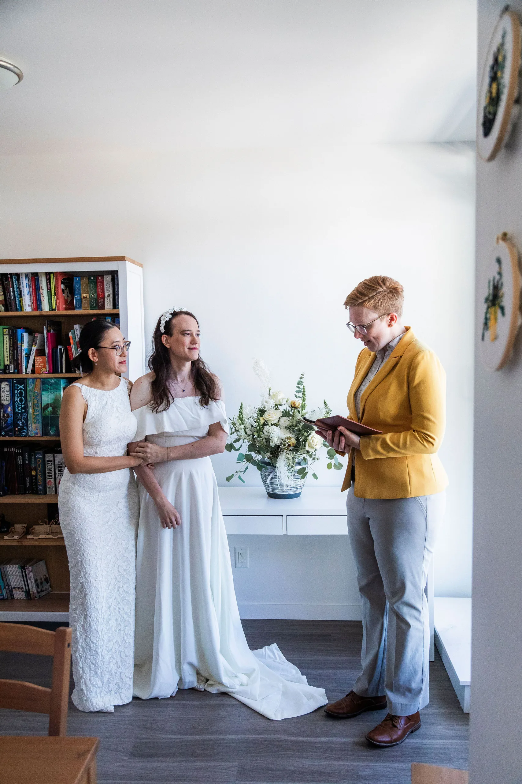 Amanda and Emily during their at home ceremony with Officiant Beth, John Bello Photography