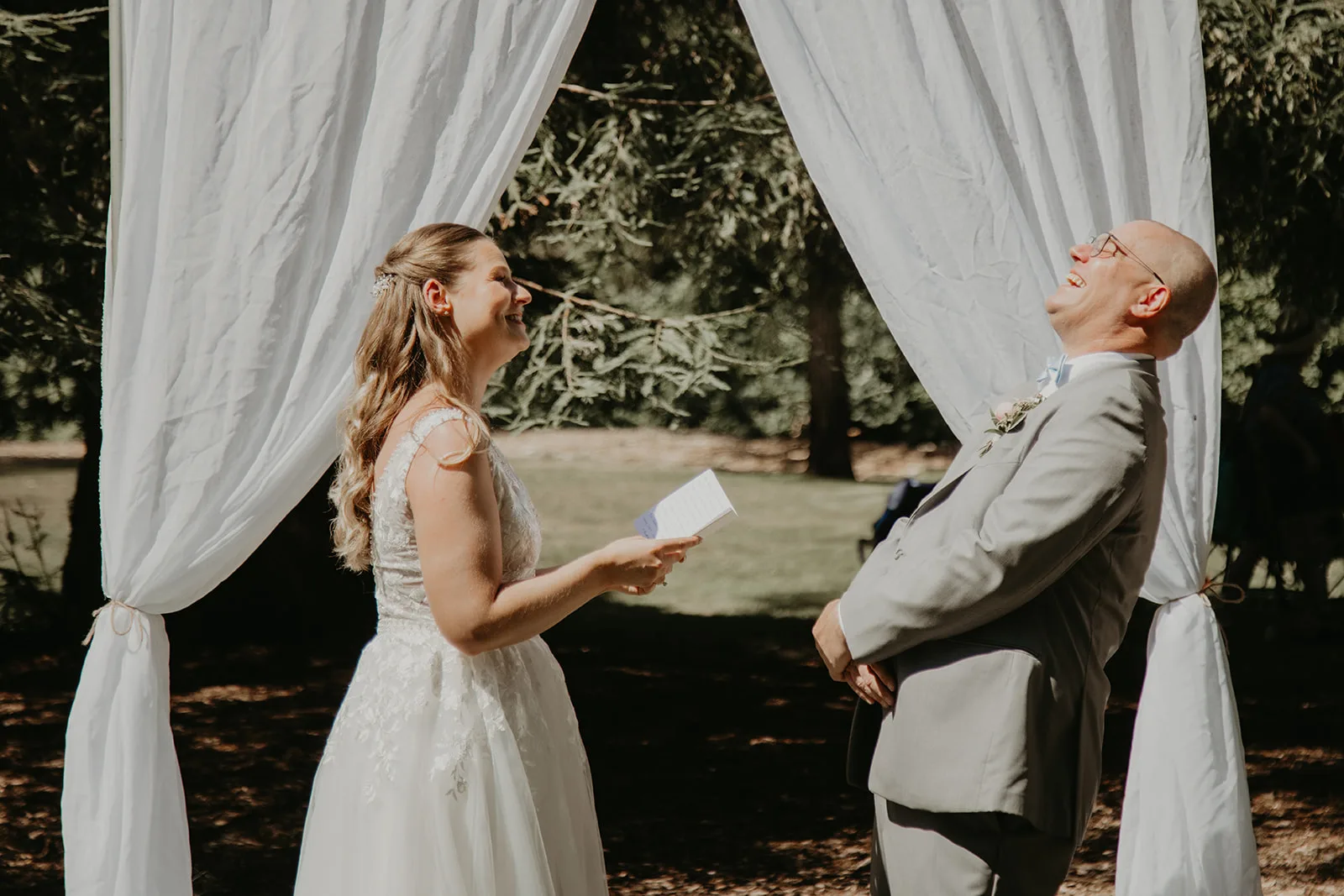 Kailie and Steen exchanging vows at their wedding ceremony, Erica Miller Photography