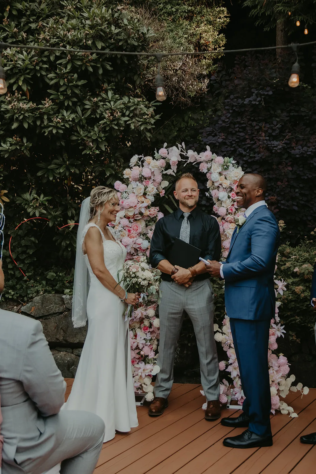 Ray and Laura during their backyard ceremony with Officiant Shawn G