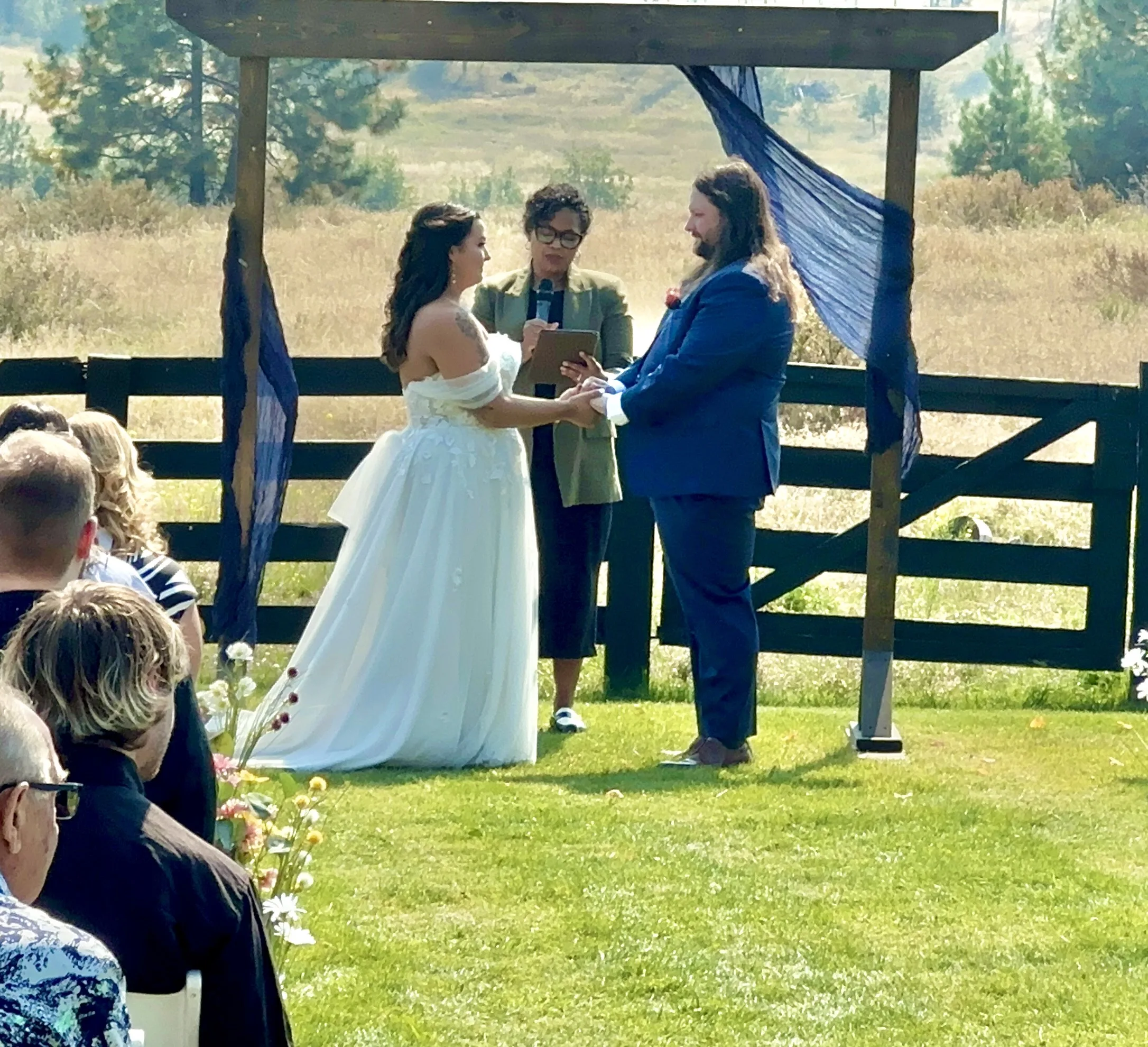 Savannah and Christian with Officiant Simone during their ceremony