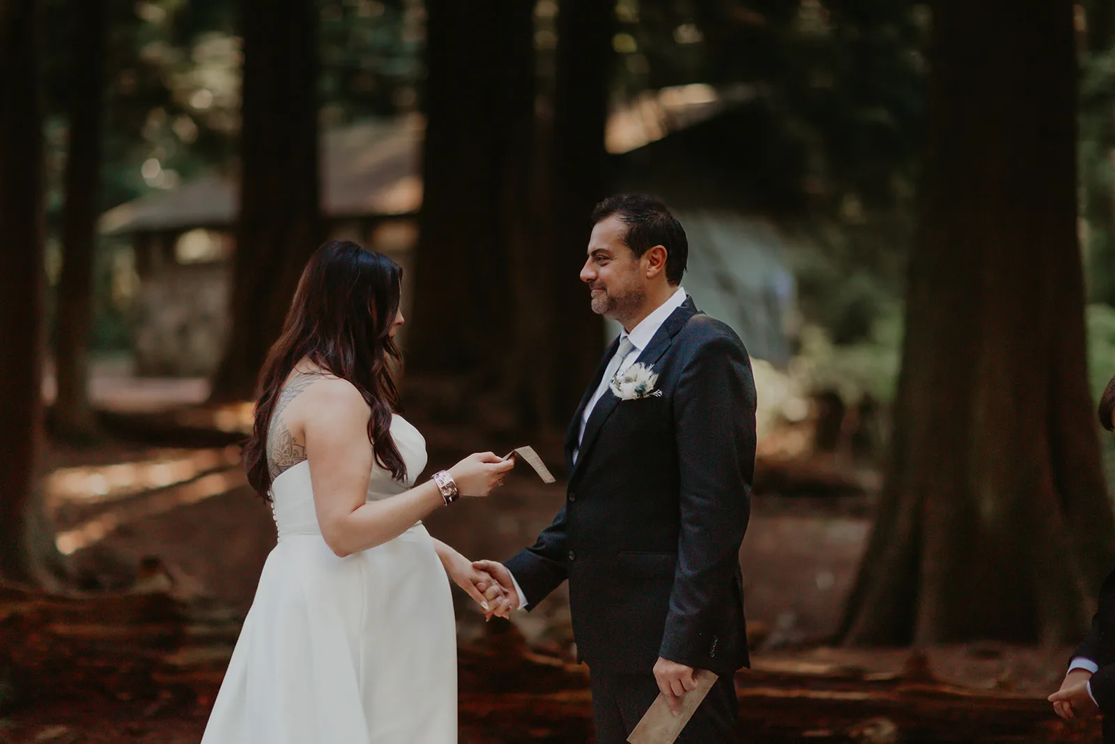 Jean and Patrik exchanging vows in the forest with Young Hip & Married