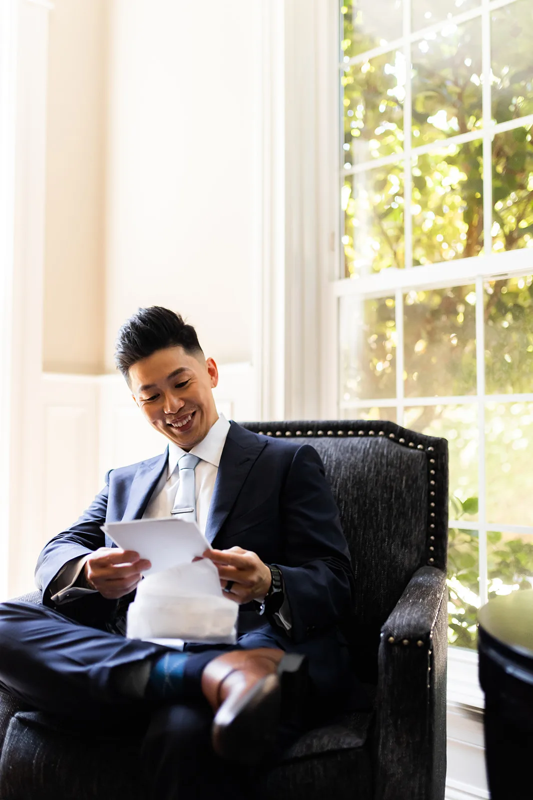 Groom Alfred opens his wedding letter and gift from Bride Rhonda before their ceremony, Esther Moerman Photography